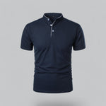 Navy blue polo shirt on a gray background