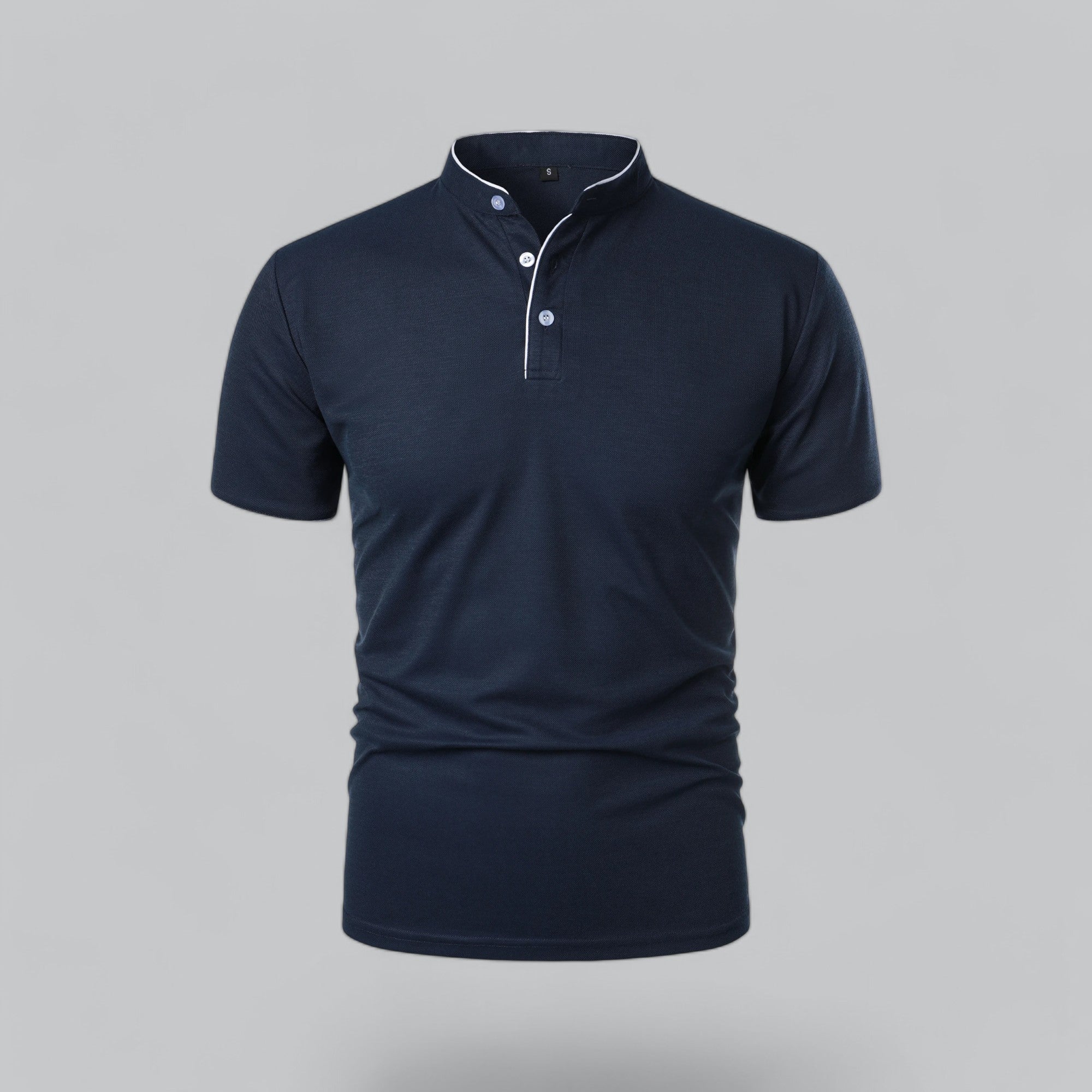 Navy blue polo shirt on a gray background