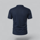Navy blue polo shirt on a gray background