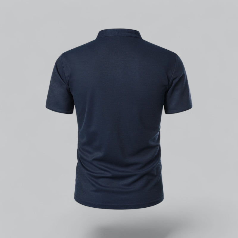Navy blue polo shirt on a gray background