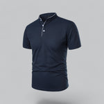 Navy blue polo shirt on a gray background