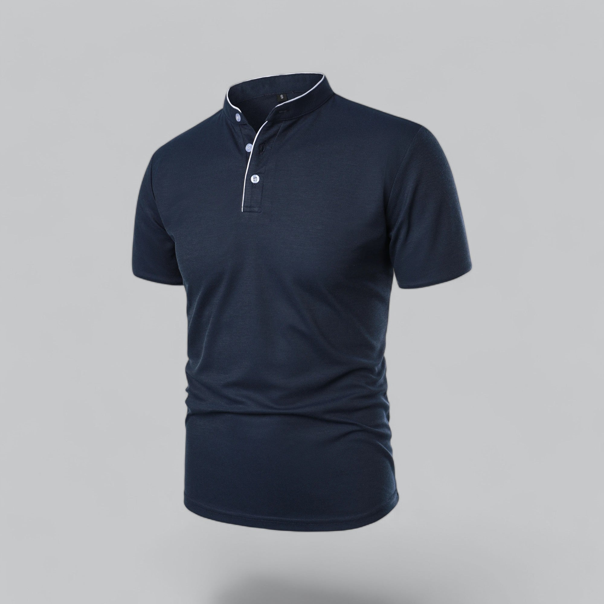 Navy blue polo shirt on a gray background