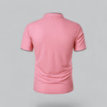 Pink polo shirt on a gray background