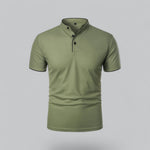 Green polo shirt on a gray background