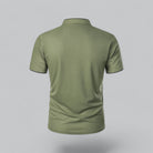 Green polo shirt on a gray background