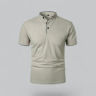 Beige short-sleeve polo shirt on a light gray background