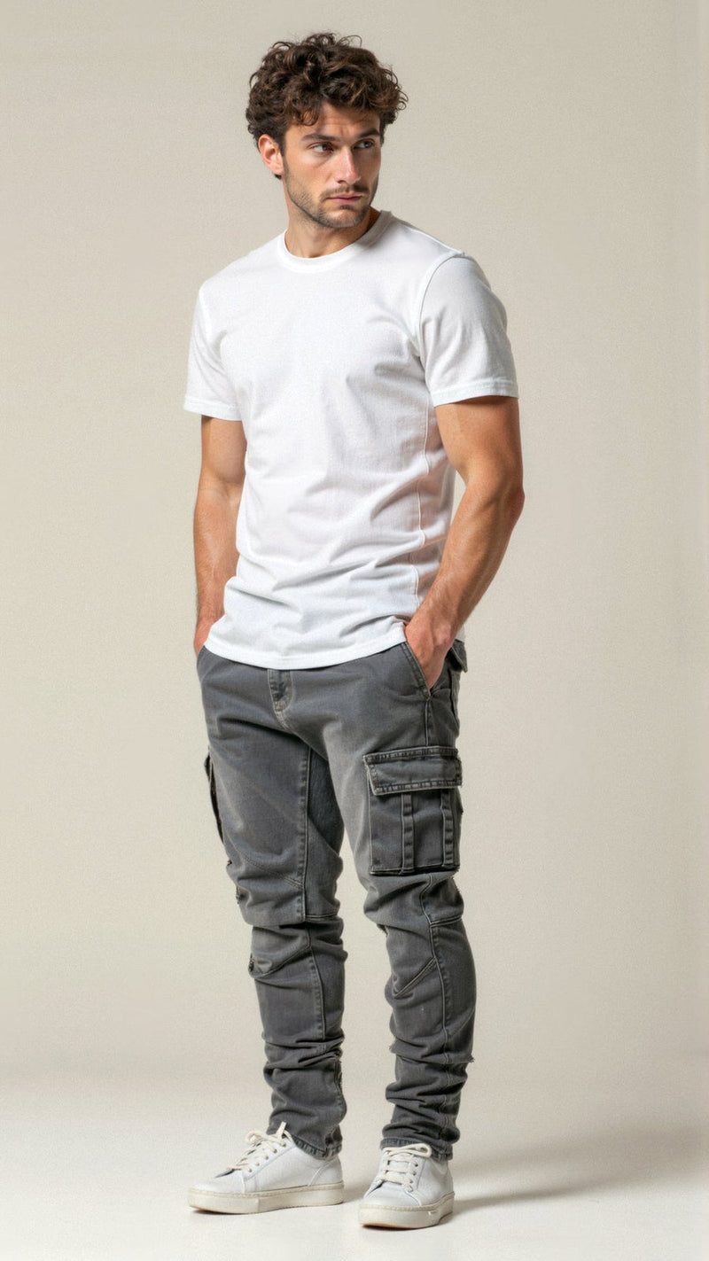 Man wearing a white t-shirt and gray cargo pants against a beige background