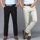 Two pairs of pants, one black and one beige, worn by models on a gray background.
