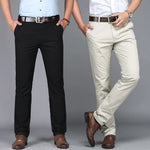 Two pairs of pants, one black and one beige, worn by models on a gray background.