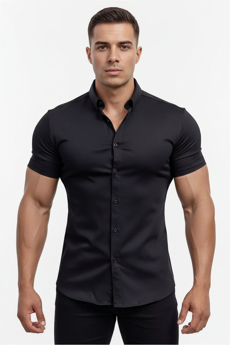 Man wearing a black shirt standing by a pool