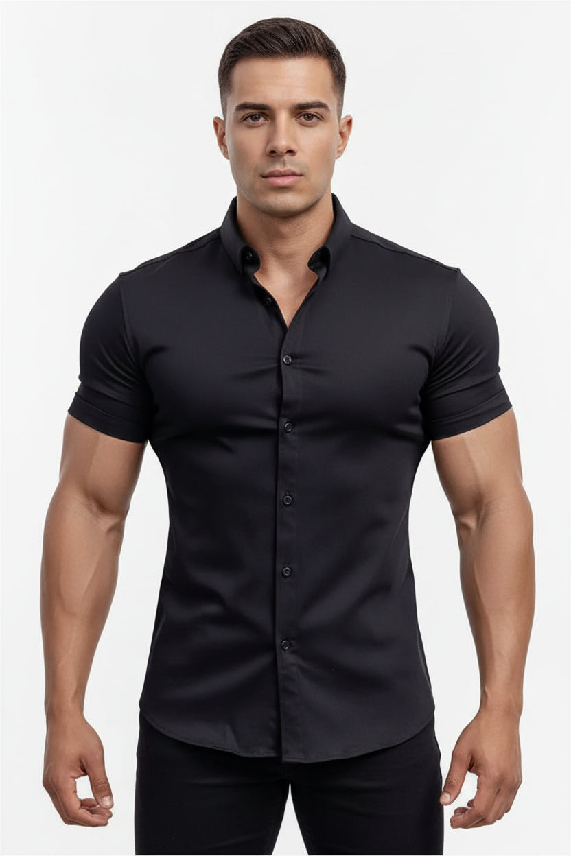 Man wearing a black shirt standing by a pool