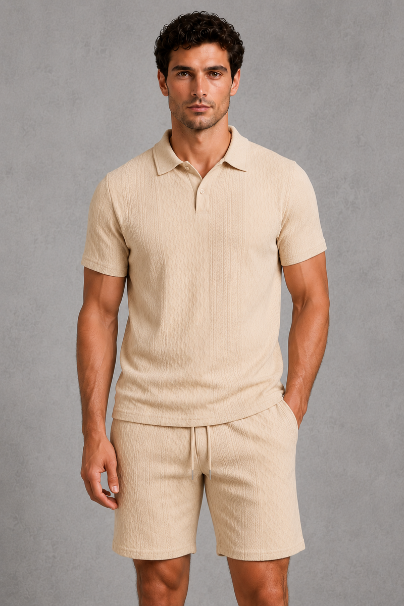 Man wearing a beige polo shirt and shorts against a gray background