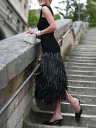 Raffia knit midi dress with tassel detailing and stretch fit silhouette