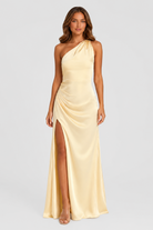 Women’s beige asymmetric maxi dress with elegant side split and flowing silhouette