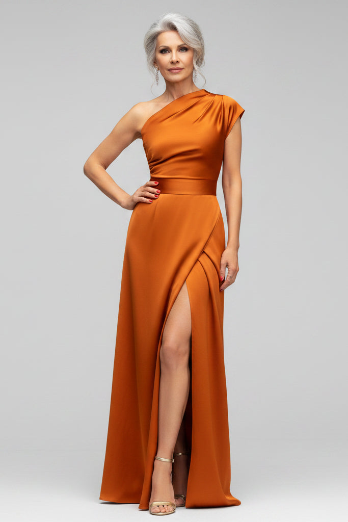 Orange one-shoulder dress with a slit on a light gray background