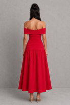 Red off-shoulder dress on a gray background