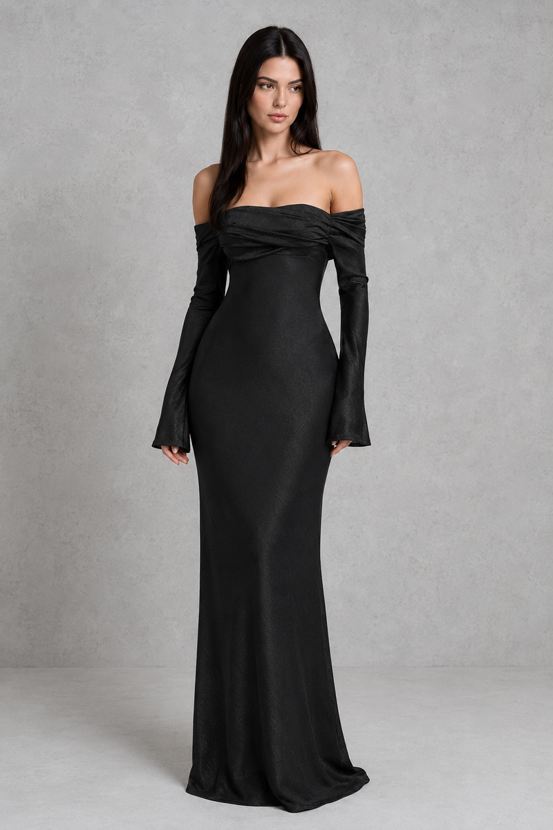 Woman wearing a black off-shoulder gown against a gray background
