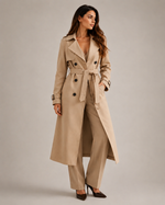 Woman wearing a gray trench coat on a plain background