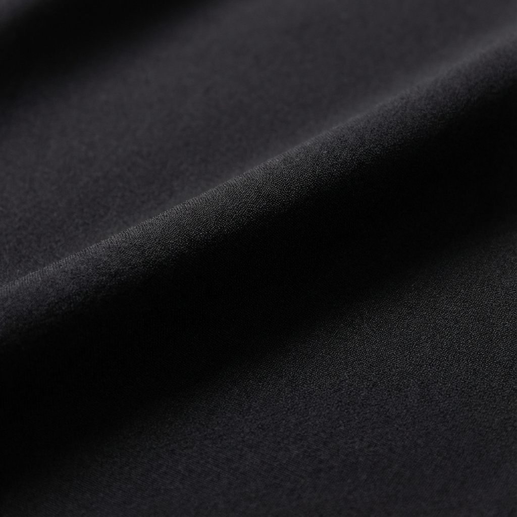 Close-up of black fabric with a textured surface