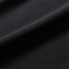 Close-up of black fabric with a textured surface
