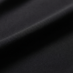 Close-up of black fabric with a textured surface