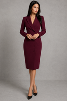 Woman wearing a burgundy dress against a gray background