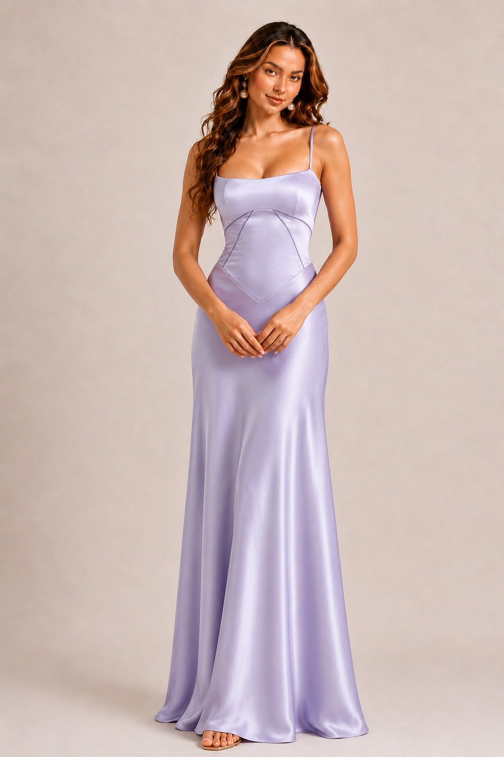 Woman wearing a lavender evening gown against a beige background
