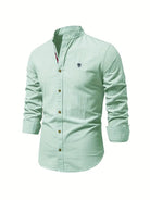 Light blue button-up shirt with a small logo on a white background