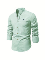 Light blue button-up shirt with a small logo on a white background
