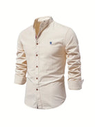 Beige button-up shirt with a small logo on a white background