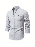 Light blue button-up shirt with a small logo on a white background