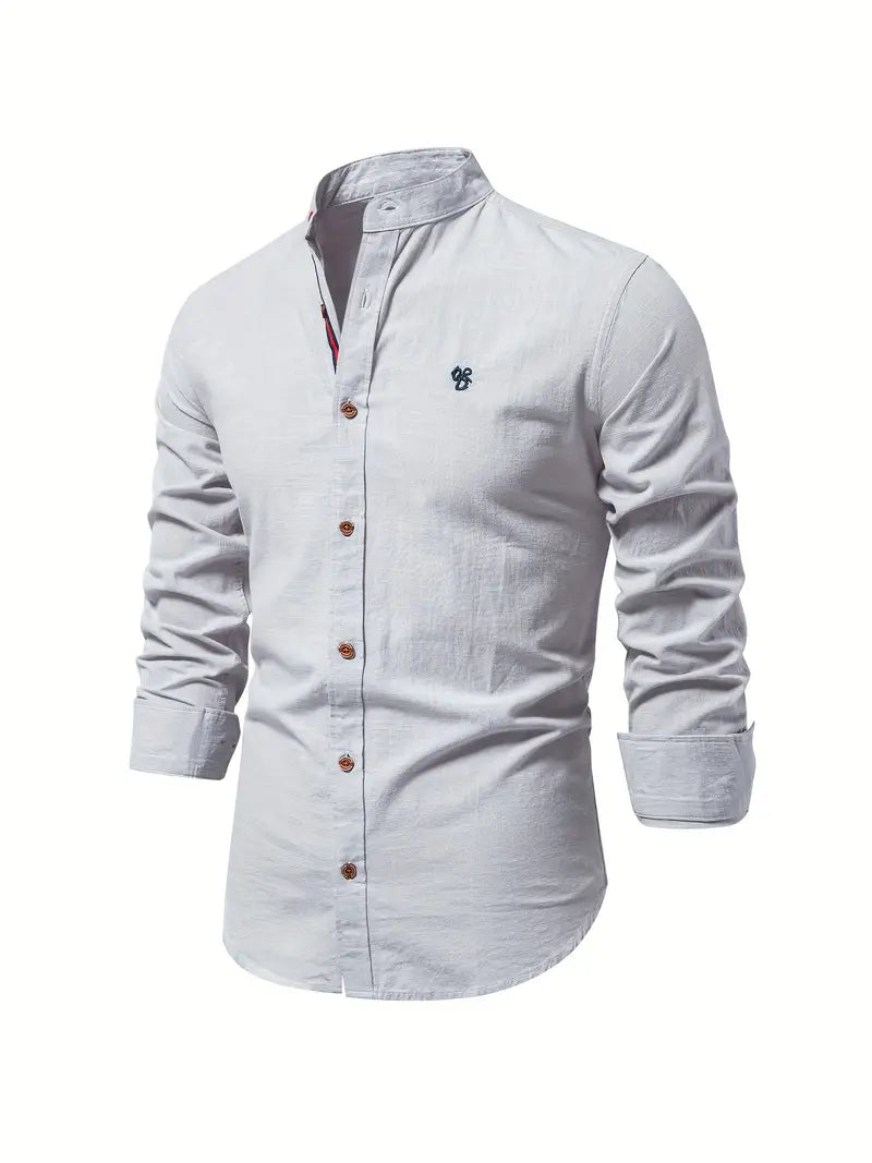 Light blue button-up shirt with a small logo on a white background
