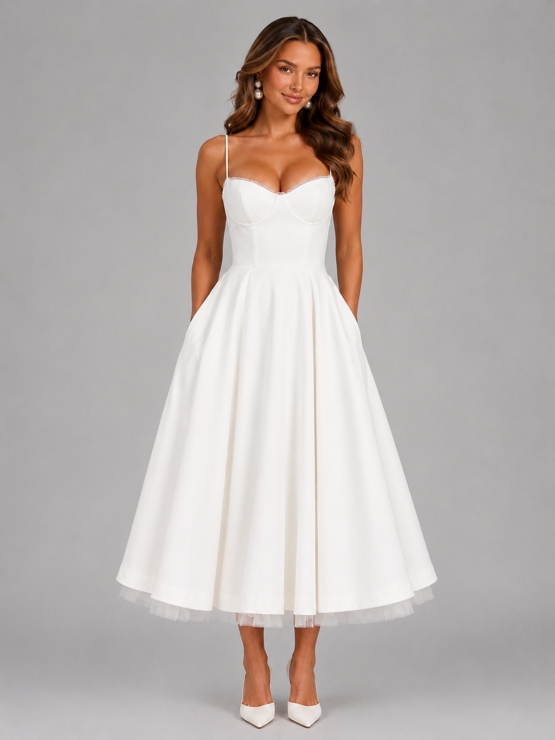 Woman wearing a white dress against a gray background