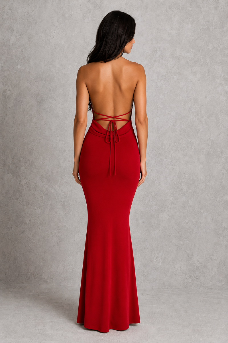 Red strapless gown with open back on a gray background