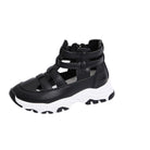 Black sandal with white sole on a white background