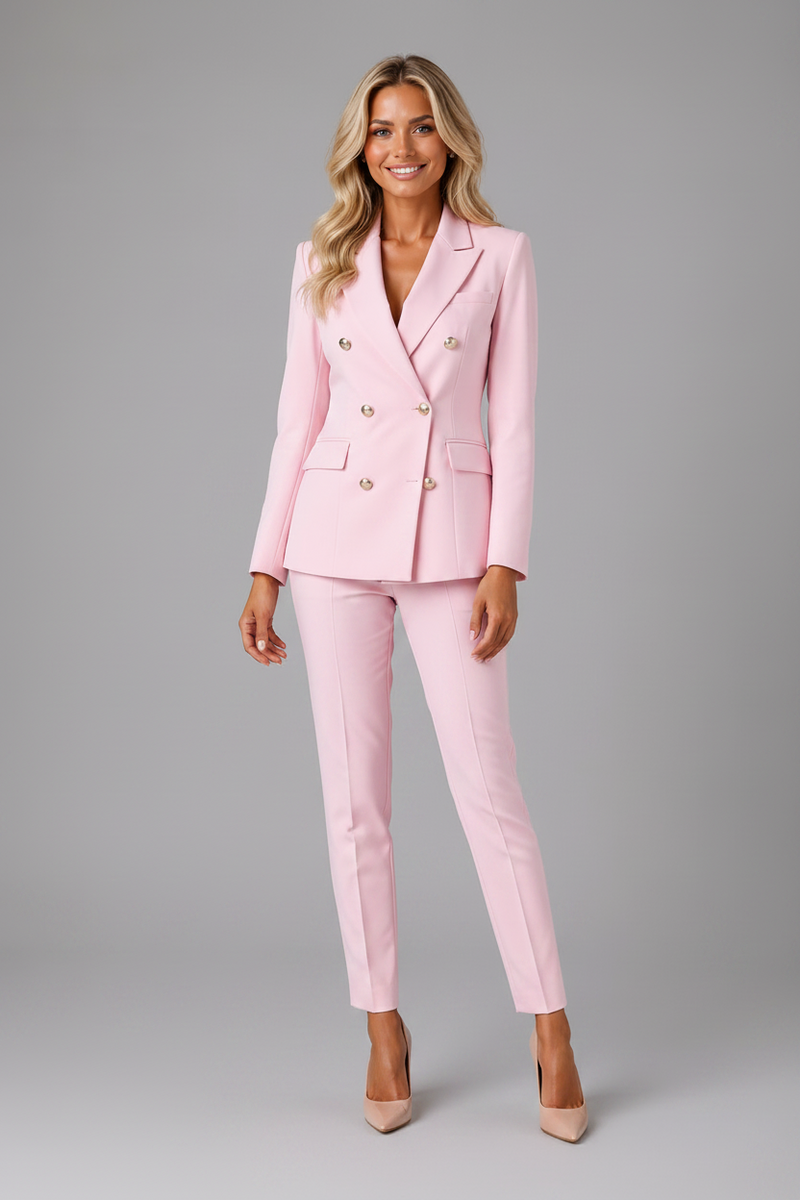 Woman wearing a pink suit on a gray background