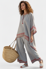 Women’s embroidered blouse with asymmetrical design and wide leg pants set