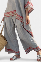 Women’s embroidered blouse with asymmetrical design and wide leg pants set