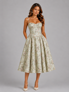 Woman wearing a floral dress on a gray background