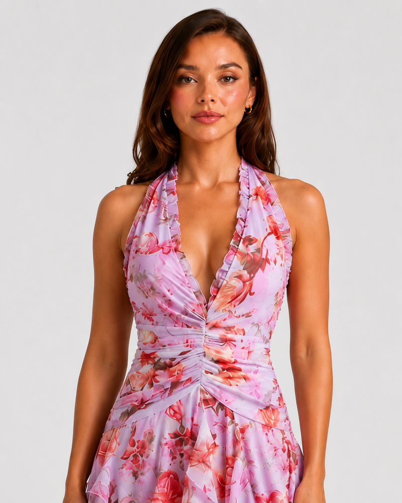 Woman wearing a floral dress with a plain background