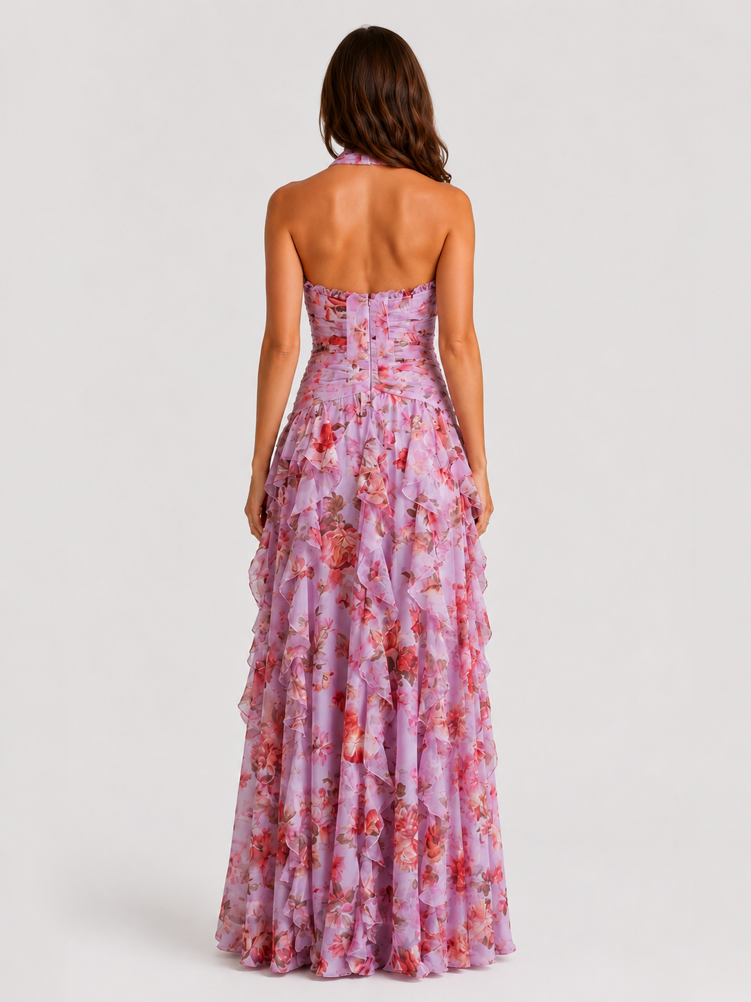 Woman wearing a floral strapless dress on a white background
