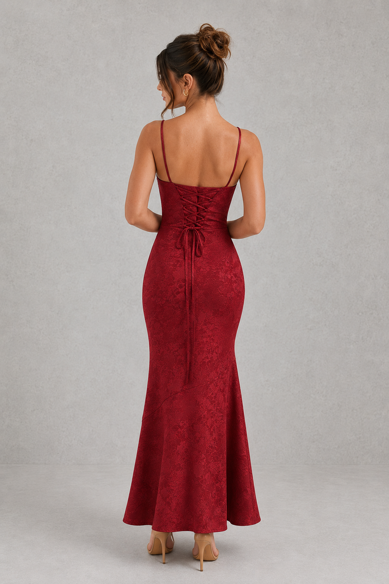 Red evening gown with open back on a gray background