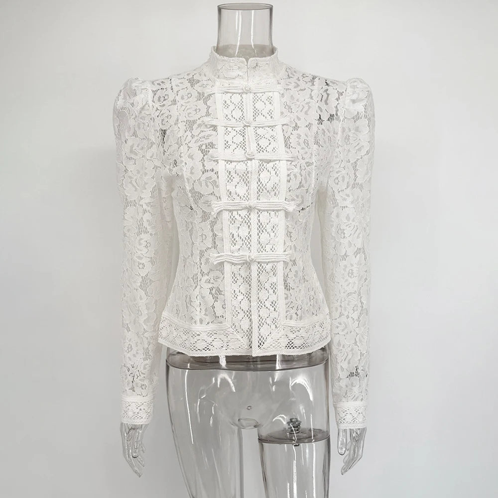 White lace blouse on a transparent mannequin against a white background