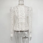 White lace blouse on a transparent mannequin against a white background