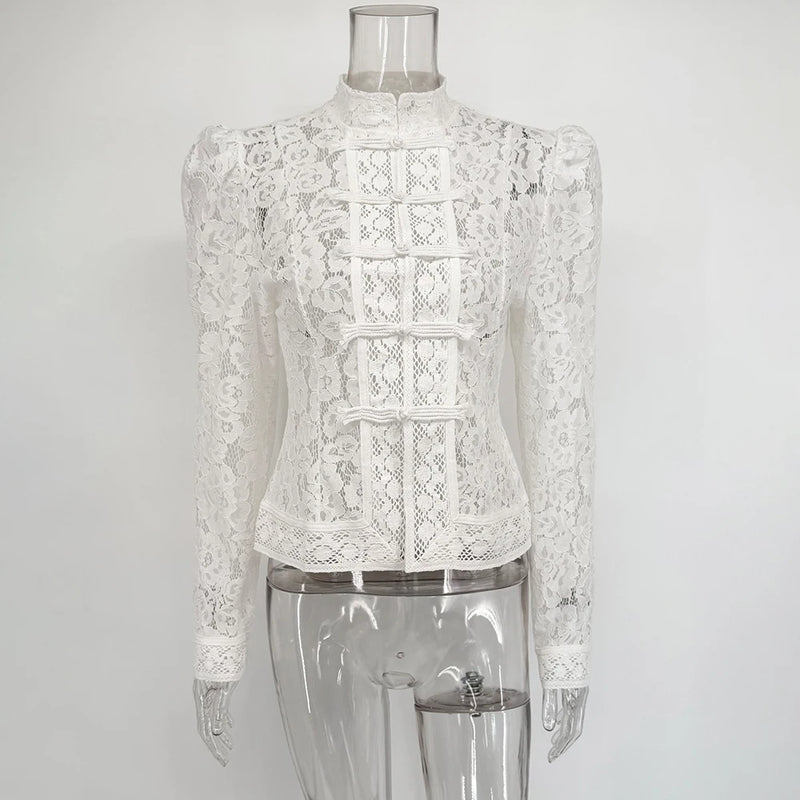 White lace blouse on a transparent mannequin against a white background