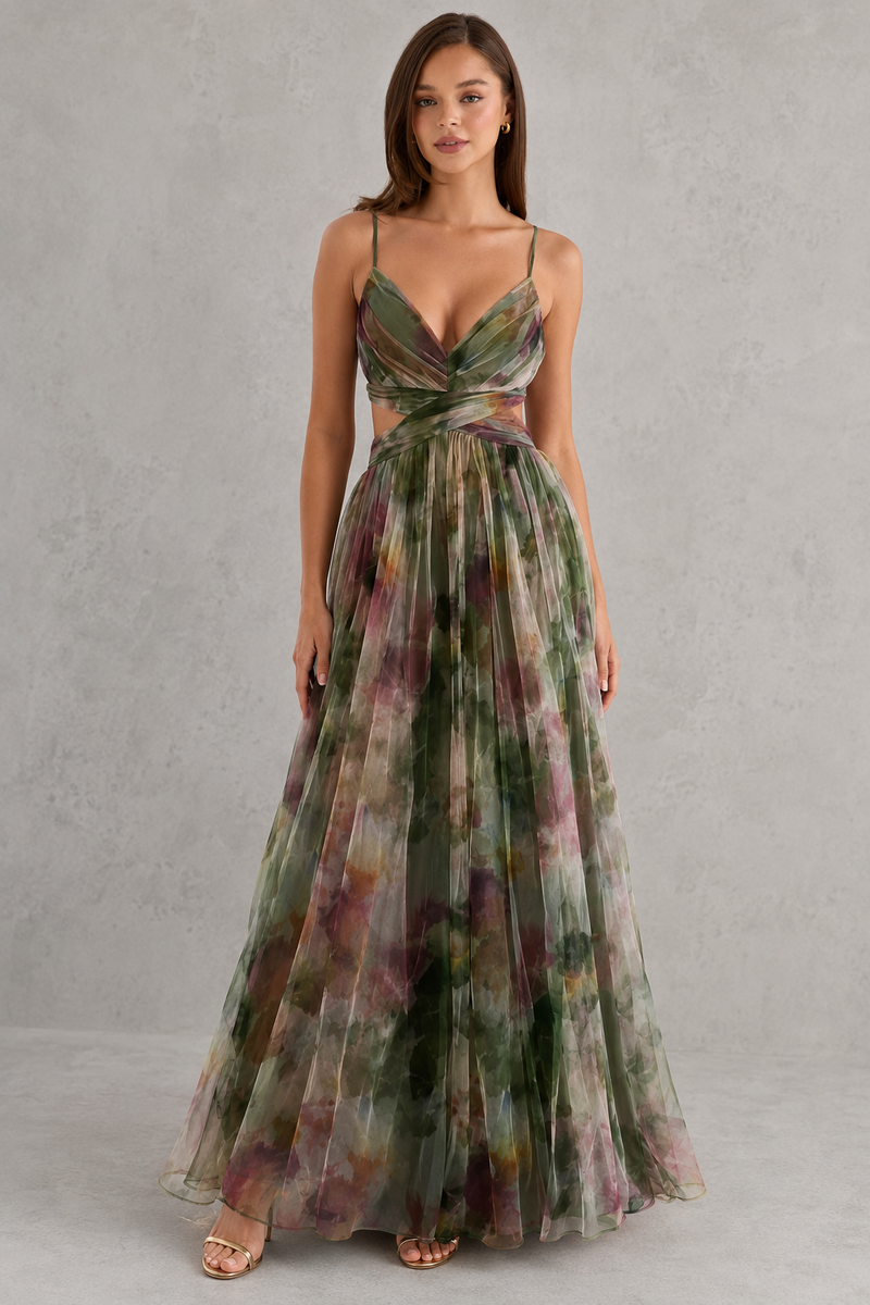 Woman wearing a floral dress against a gray background
