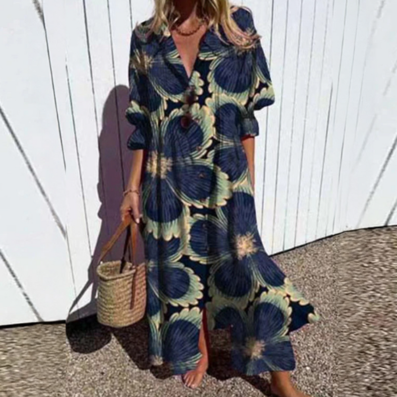 Woman wearing a floral dress with a white wooden fence background