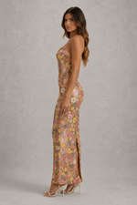 Woman wearing a floral dress with a gray background