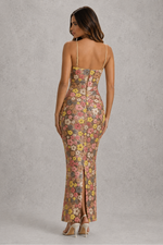 Woman wearing a floral dress with a gray background