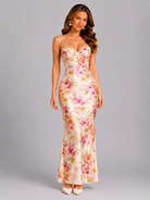 Woman wearing a floral dress on a gray background